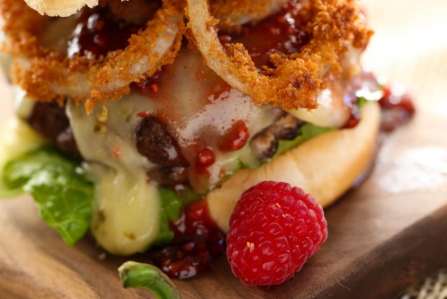 Creamy Jalapeño Stuffed Burgers with Raspberry Chipotle Sauce