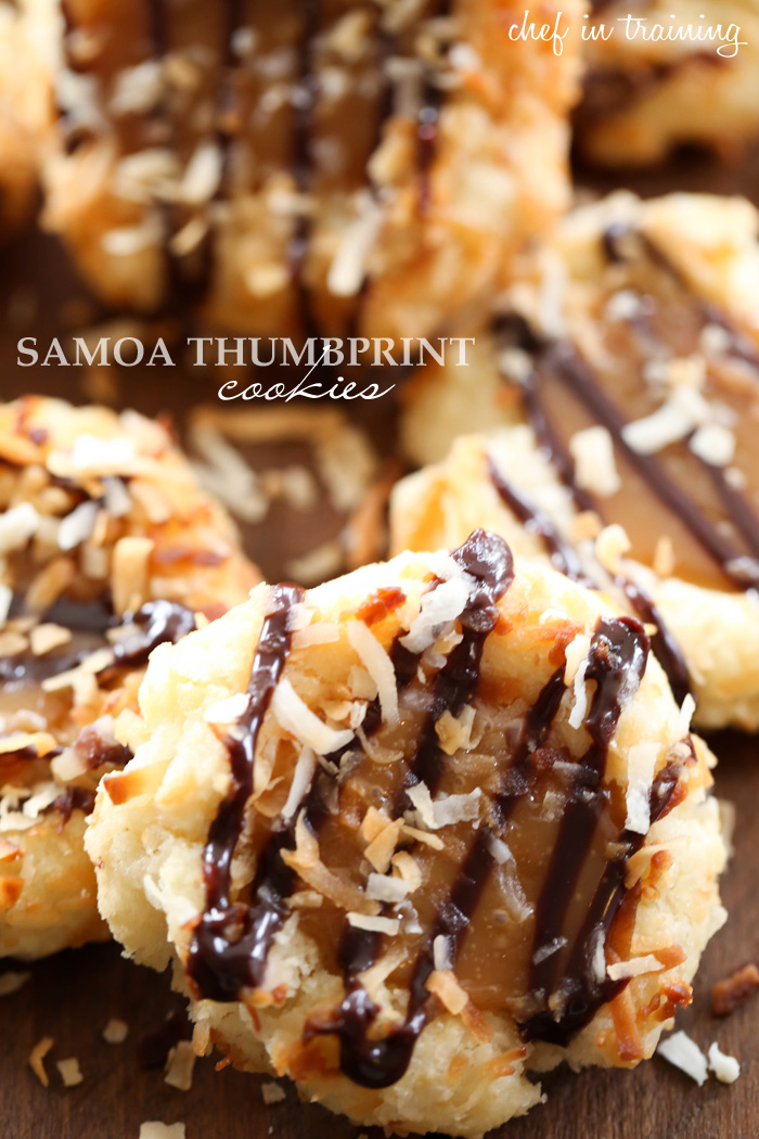Samoa Thumbprint Cookies... Soft shortbread cookies filled with a gooey caramel and coated in delicious toasted coconut and chocolate drizzle! These are such a fun spin on the classic girl scout cookies!
