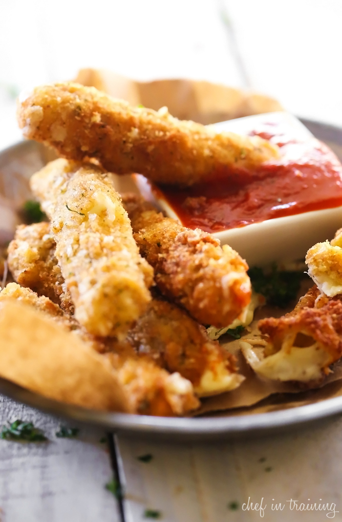 Homemade Mozzarella Sticks... these are easy and absolutely DELICIOUS! The crispy outside filled with ooey gooey cheese makes for one addictive and tasty appetizer!