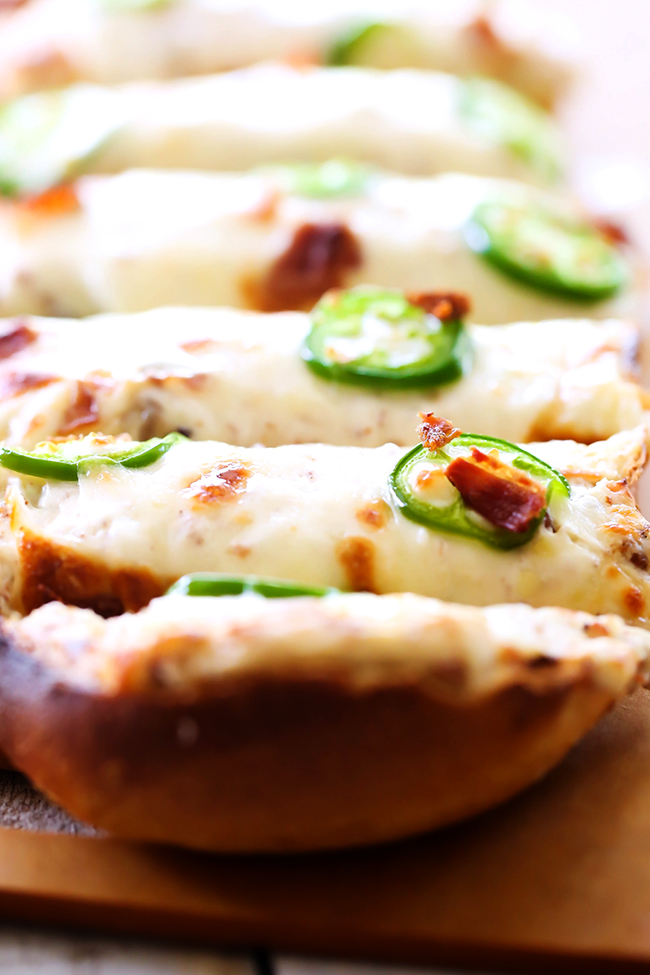 Cheesy Jalapeno Bacon Bread... this recipe is cheesy, flavorful and has a delicious kick of heat with a cream cheese  spread to cool it down... it truly is INCREDIBLE and will be one of the most talked about appetizers!