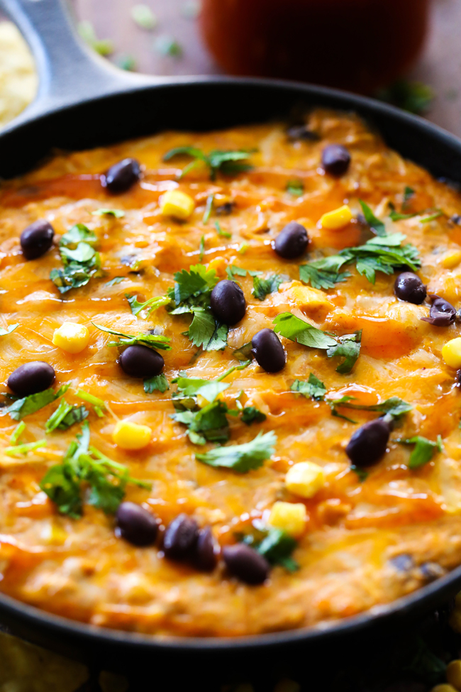 Chicken Enchilada Dip... The delicious flavors and ingredients of chicken enchiladas combine to form one unforgettable dip!