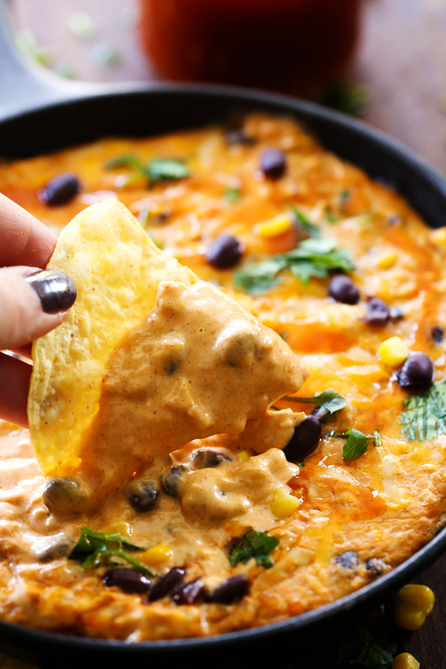 Chicken Enchilada Dip... The delicious flavors and ingredients of chicken enchiladas combine to form one unforgettable dip!