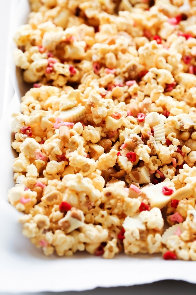 REESE'S Sweetheart Popcorn... A tasty and festive popcorn that is a delicious blend of white chocolate, peanut butter, peanuts and of course REESE's chocolates! #sponsored