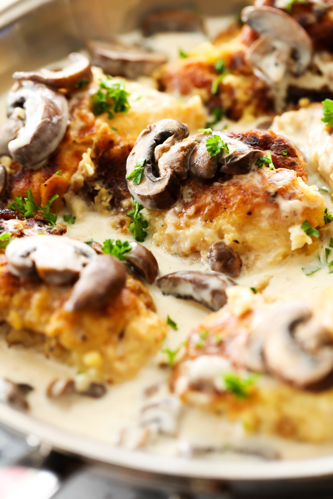Pan-Fried Creamy Mushroom Chicken... A delicious battered chicken that is first pan-fried then baked and topped with a creamy mushroom gravy. This is a true restaurant quality dinner that will quickly become a new family favorite!