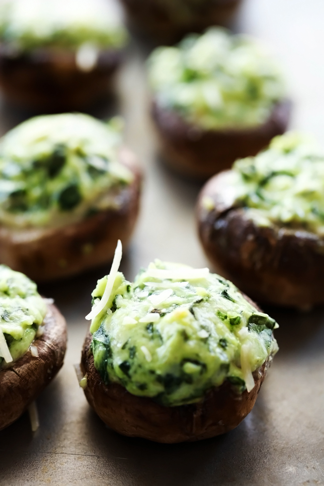 Spinach Stuffed Mushrooms... A flavorful cream cheese spinach mixture stuffed inside mushrooms and cooked to perfection! This is one tasty and addictive appetizer!