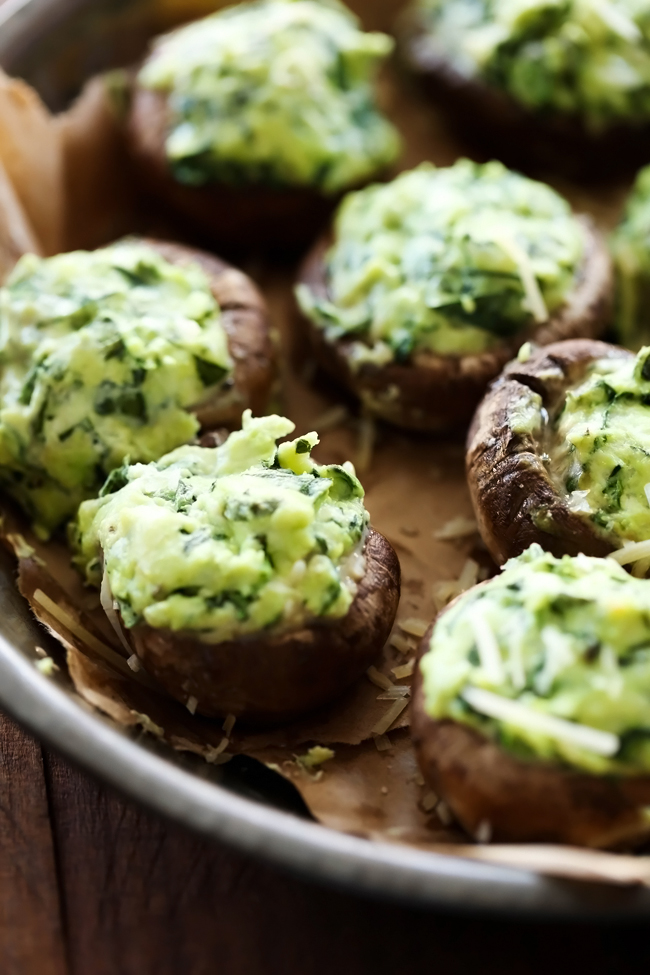 Spinach Stuffed Mushrooms... A flavorful cream cheese spinach mixture stuffed inside mushrooms and cooked to perfection! This is one tasty and addictive appetizer!
