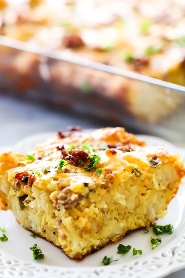 Tater Tot Breakfast Casserole... All of your favorite breakfast items combine to make one out of this world meal! Tater tots, eggs, sausage and cheese come together in a unique way for an easy and delicious breakfast!