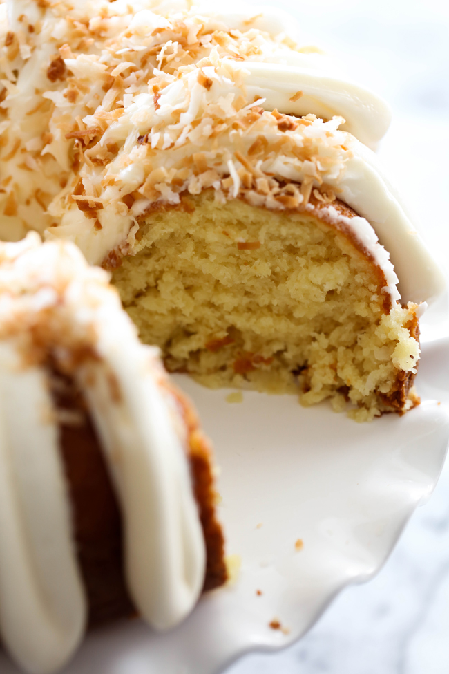 Coconut Bundt Cake... This is an incredibly moist cake loaded with coconut flavor! The Cream Cheese Frosting on top is the perfect pairing. This cake with be loved by all who try it!