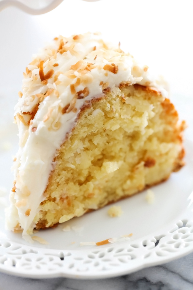 Coconut Bundt Cake... This is an incredibly moist cake loaded with coconut flavor! The Cream Cheese Frosting on top is the perfect pairing. This cake with be loved by all who try it!