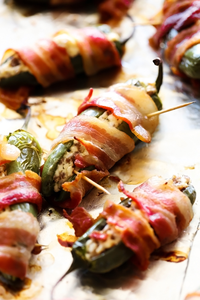 Creamy Sausage Bacon Jalapeño Poppers... These Jalapeño Poppers are extra special! They are stuffed with a creamy sausage filling and wrapped in crispy bacon! This will be the hit of any gathering!