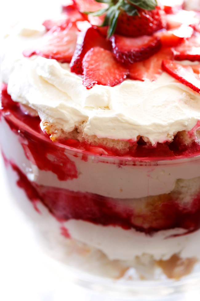 Strawberry Shortcake Trifle... A light and delicious trifle layered with strawberry sauce, angel food cake and whipped cream! This will be a hit wherever it is served!