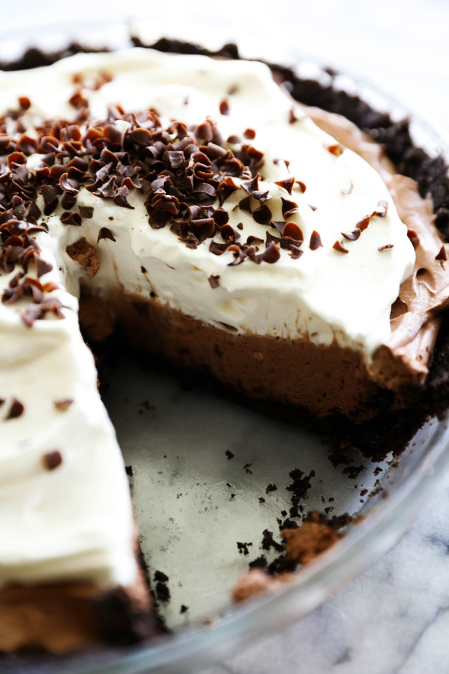 No Bake Chocolate Mousse Pie... A delicious silky smooth chocolate mousse filling with a Oreo cookie crust and topped with sweetened whipped cream. This is truly a magnificent pie!