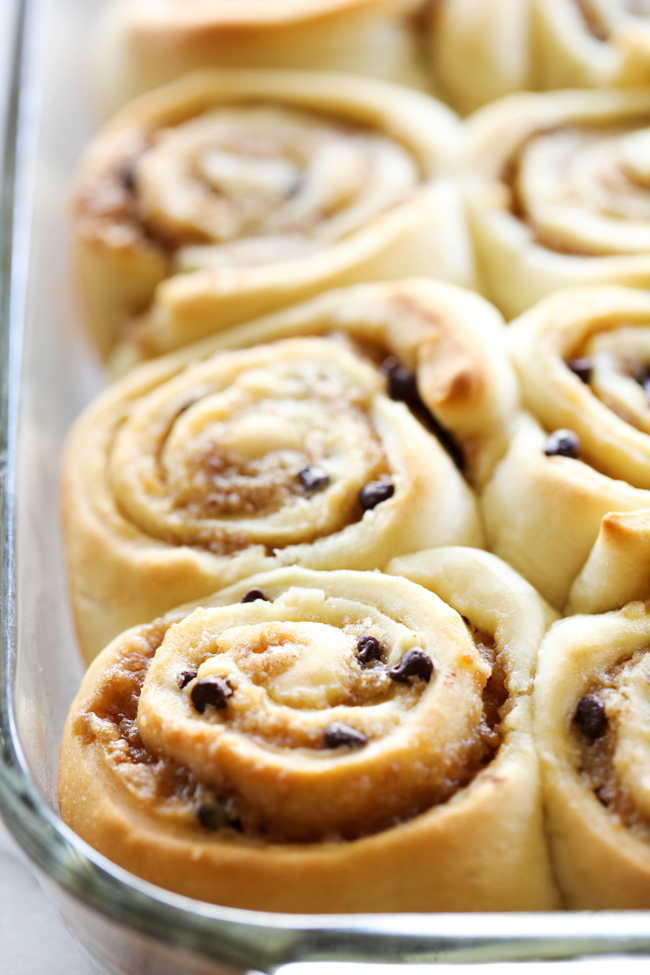 Samoa Sweet Rolls... These sweet rolls are made with a super simple cake-mix dough and have a delicious brown sugar toasted coconut filling and mini chocolate chips. They are topped with THE BEST caramel frosting, garnished with toasted coconut and drizzled with caramel and chocolate. They are unbelievably good!