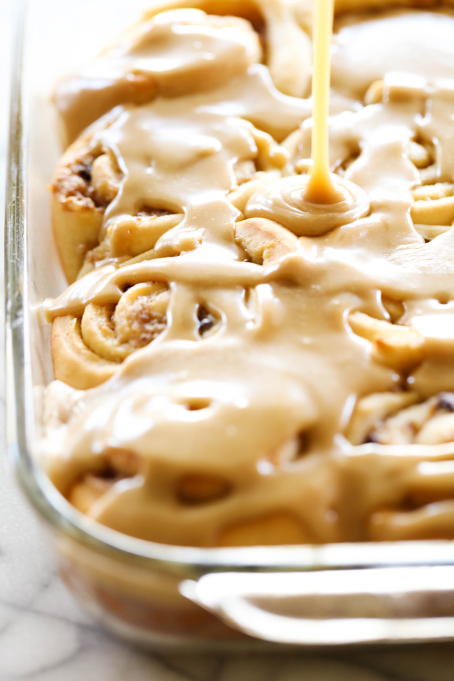Samoa Sweet Rolls... These sweet rolls are made with a super simple cake-mix dough and have a delicious brown sugar toasted coconut filling and mini chocolate chips. They are topped with THE BEST caramel frosting, garnished with toasted coconut and drizzled with caramel and chocolate. They are unbelievably good!