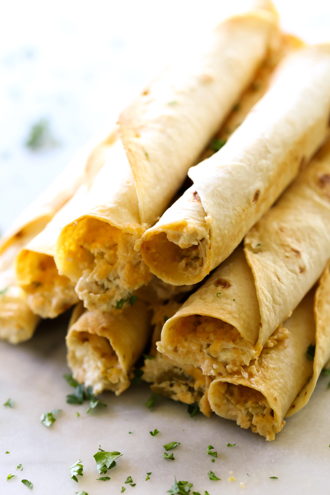 These Baked Creamy Chile Verde Chicken Taquitos are so easy to make and are beyond delicious! This will quickly become a new family favorite!