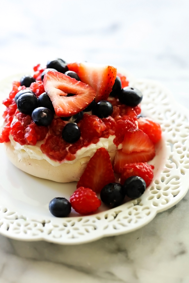 This recipe for Easy Pavlova is light, crisp, chewy and airy. It is absolutely delicious topped with whipped cream and fresh fruit!