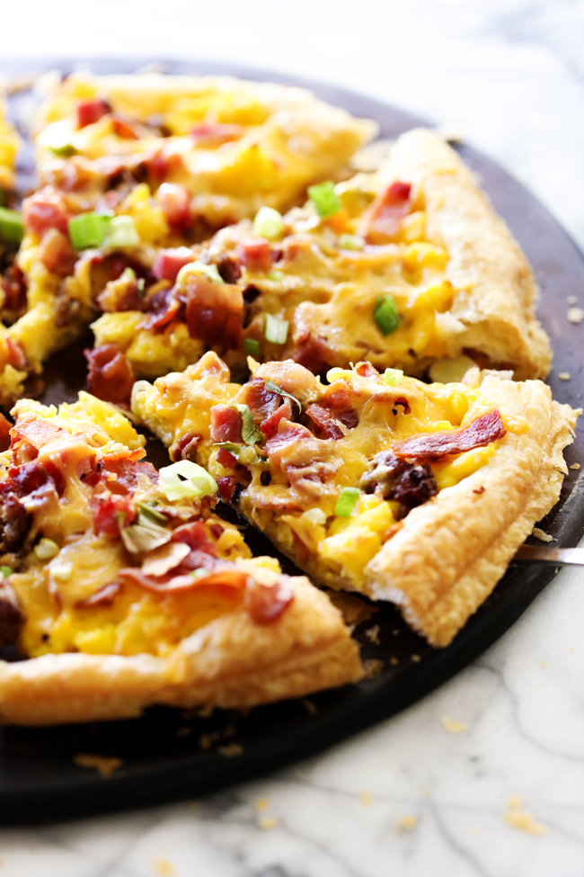 This Puff Pastry Breakfast Pizza is SO easy to make and is such a crowd pleaser! It has everything you love about breakfast topped on a delicious buttery flaky crust!