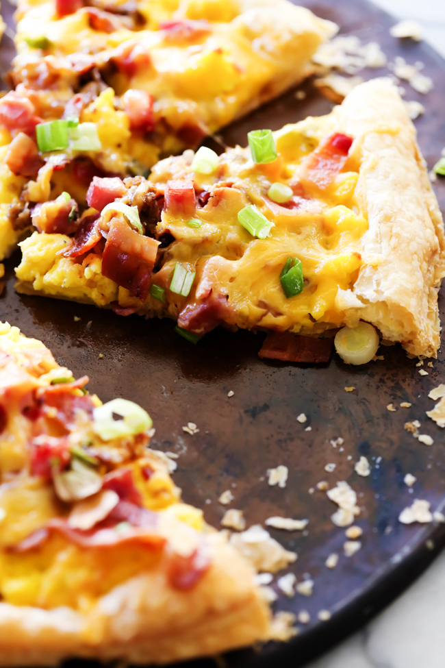 This Puff Pastry Breakfast Pizza is SO easy to make and is such a crowd pleaser! It has everything you love about breakfast topped on a delicious buttery flaky crust!