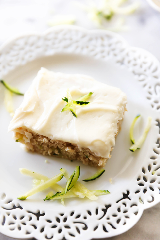 This Zucchini Sheet Cake is so moist and delicious! It feeds a crowd and is the perfect way to use up some zucchini. The cream cheese frosting on top is fabulous!