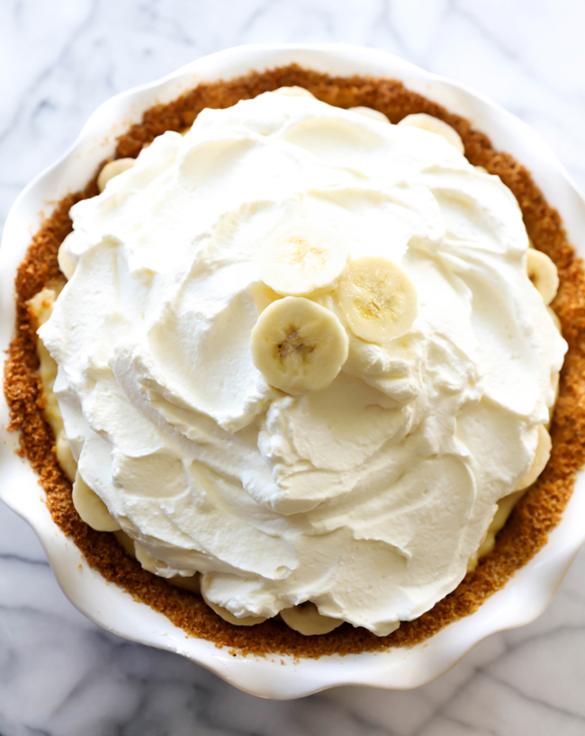 This Best Ever Banana Cream Pie is truly INCREDIBLE! It has a homemade graham cracker crust, delicious banana cream filling and topped with whipped cream. It is perfect for any occasion!