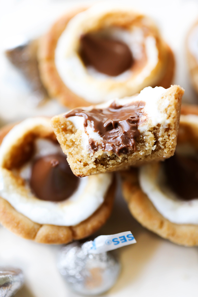 These HERSHEY'S KISSES Peanut Butter Marshmallow Cookie Cups are delightful! They have a crisp and chewy peanut butter cookie outside and are filled with HERSHEY'S KISSES Chocolates and gooey marshmallows. Each bite is absolutely heavenly! #sponsored HERSHEY'S Chocolate
