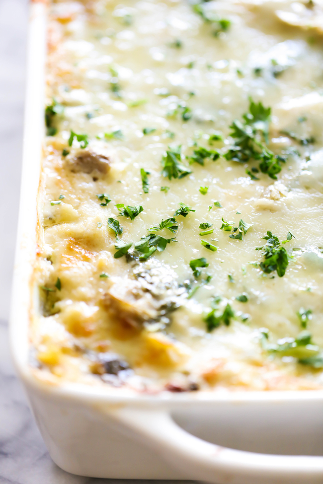This Spinach Artichoke Lasagna is so rich, creamy and tastes INCREDIBLE! This recipe will quickly become a new family favorite!