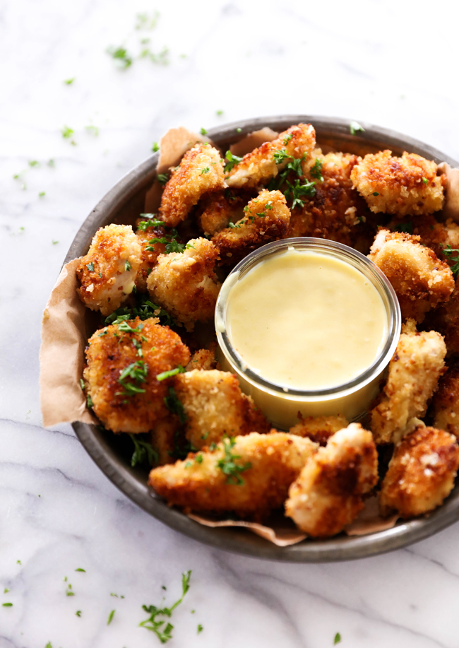 These Homemade Chicken Nuggets are so much healthier and much more delicious than anything you could buy! The outside coating is perfection! This recipe makes for a great meal or appetizer!