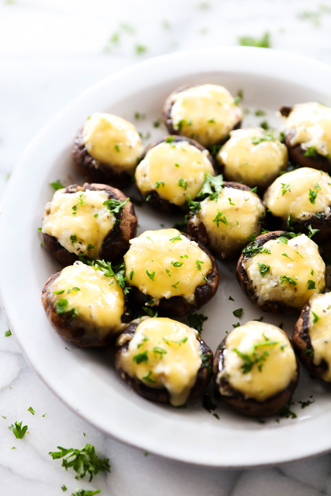 These 5 Cheese Stuffed Mushrooms are packed with bold flavor and a variety of cheese. These are the perfect appetizer to serve a crowd! Everyone LOVES these!