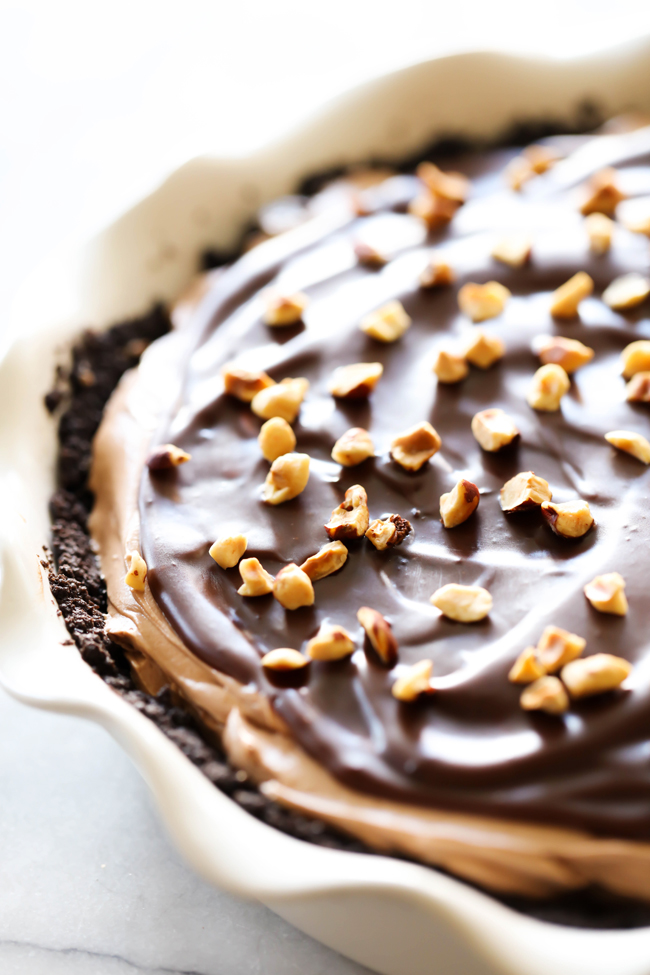 This Chocolate Hazelnut Cream Pie is rich, creamy and perfect for fulfilling that chocolate craving! It begins with a homemade Oreo crust, has a creamy chocolate hazelnut center, a rich and smooth chocolate topping and is garnished with toasted hazelnuts.