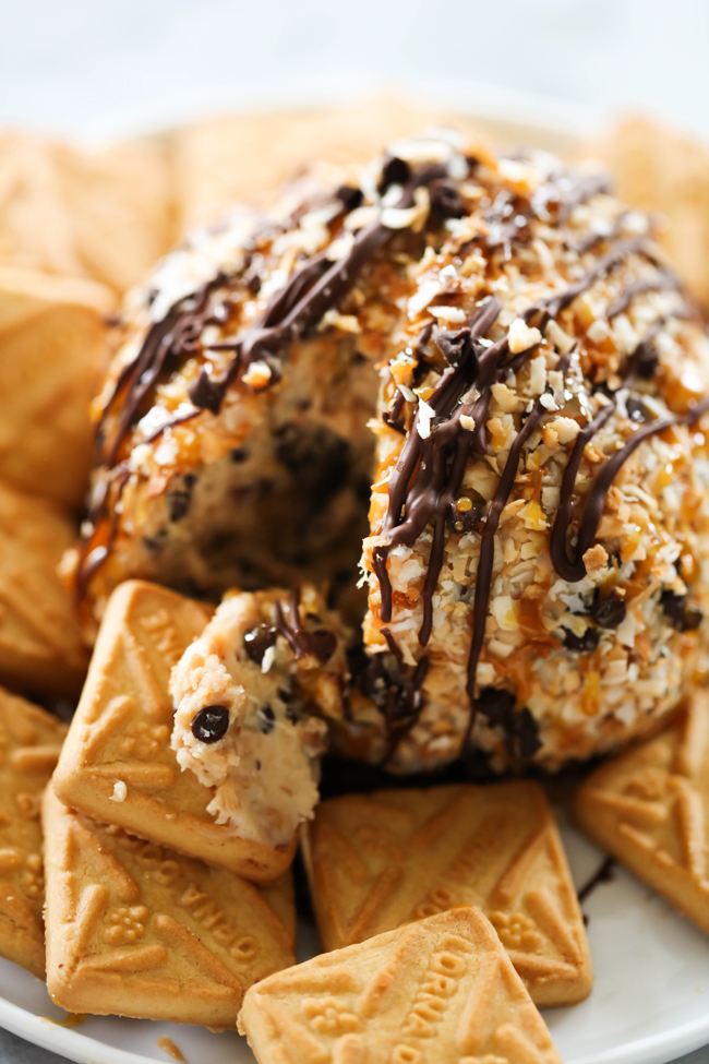 This Samoa Cheese Ball is loaded with caramel, chocolate and coconut and is such a delightful sweet treat! It is served with shortbread cookies and is great for any party or get together!