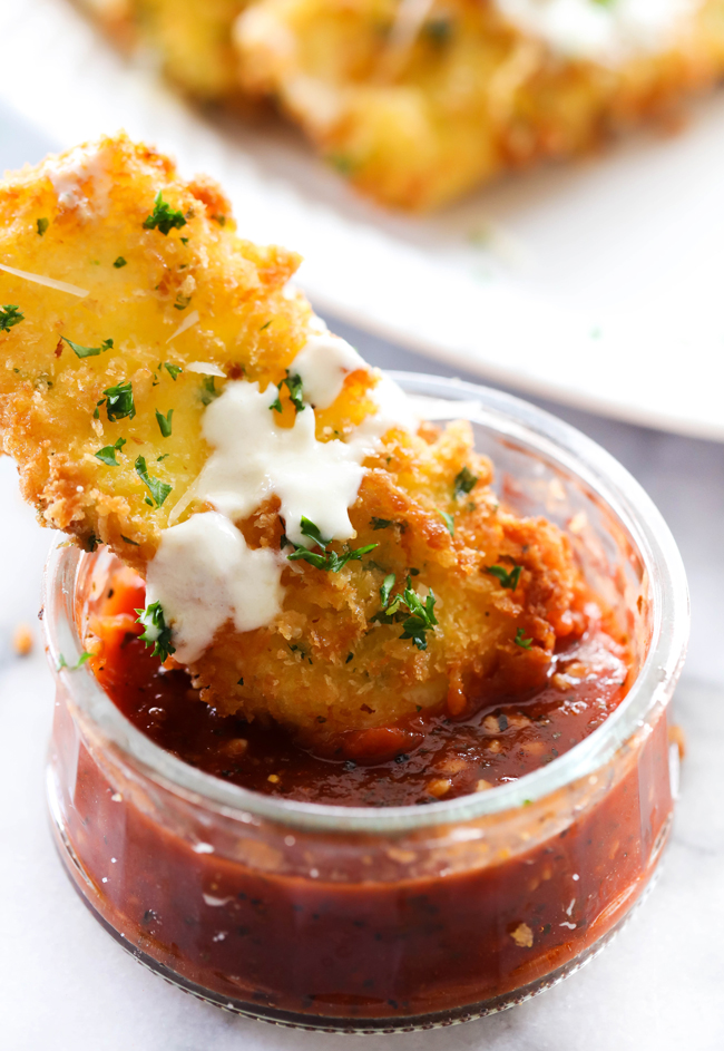 This Fried Mozzarella is simple, delicious and a perfect appetizer. The outside is crispy with a gooey soft cheesy inside. It is drizzled with Alfredo and paired with Marinara. The flavor combo makes this one outrageously tasty party food!