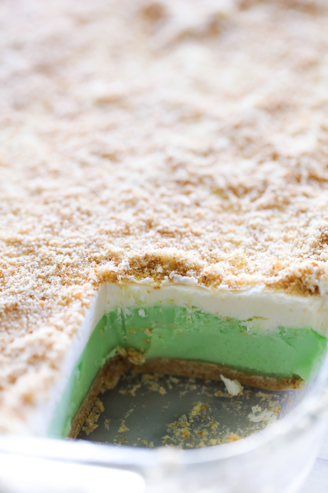This Lime Sherbet Dessert is cool and refreshing. It has the most delicious soft cookie crust and is topped with sherbet and a homemade whipped topping. This dessert is perfect for a warm day!
