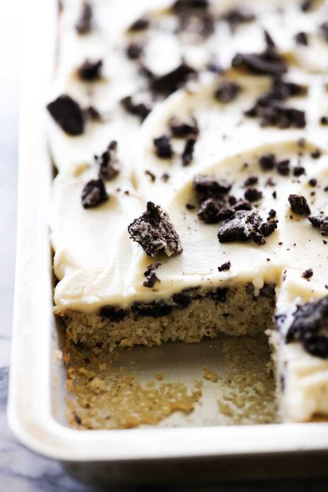 This Cookies and Cream Sheet Cake is super moist and absolutely delicious! It is perfect for parties and get togethers. It is loaded with Oreo Cookies and topped with a delicious creamy frosting.