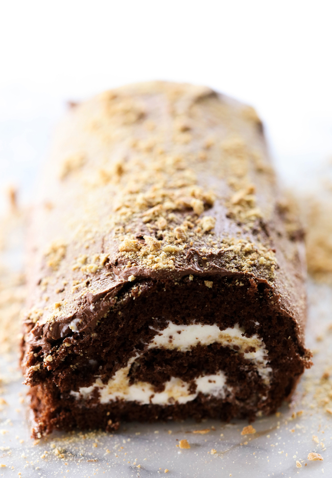 This S'more Cake Roll is outstanding! It begins with a delicious moist chocolate cake and is filled with a wonderful marshmallow cream filling and topped with graham cracker crumbs. This is sure to be a show stopper wherever it goes!