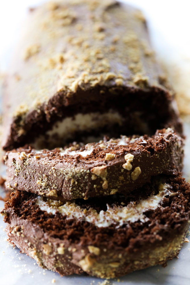 This S'more Cake Roll is outstanding! It begins with a delicious moist chocolate cake and is filled with a wonderful marshmallow cream filling and topped with graham cracker crumbs. This is sure to be a show stopper wherever it goes!