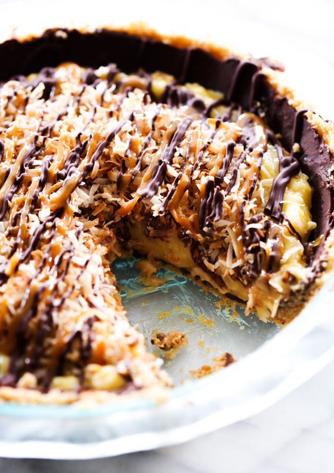 This Samoa Pie is packed with everything you love about the famous girl scout cookies only transformed into a new unforgettable dessert! It has a shortbread cookie crust layered with chocolate and a delightful coconut filling. It is also topped with chocolate and caramel and toasted coconut for the perfect finishing touch!
