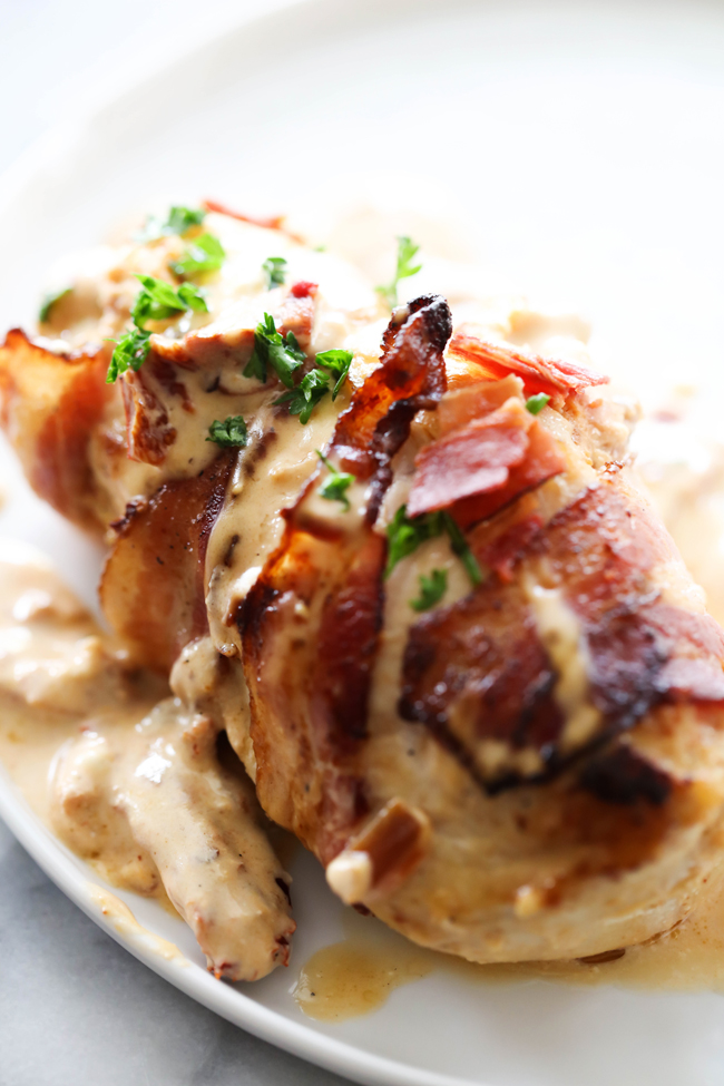 This Stuffed Chipotle Bacon Chicken is a phenomenal meal that tasted like it comes from a 5 star restaurant! It has a kick of heat from the chipotle peppers but is complimented and cooled down with a deliciously creamy sauce. The chicken is wrapped in bacon for an added wonderful flavor.