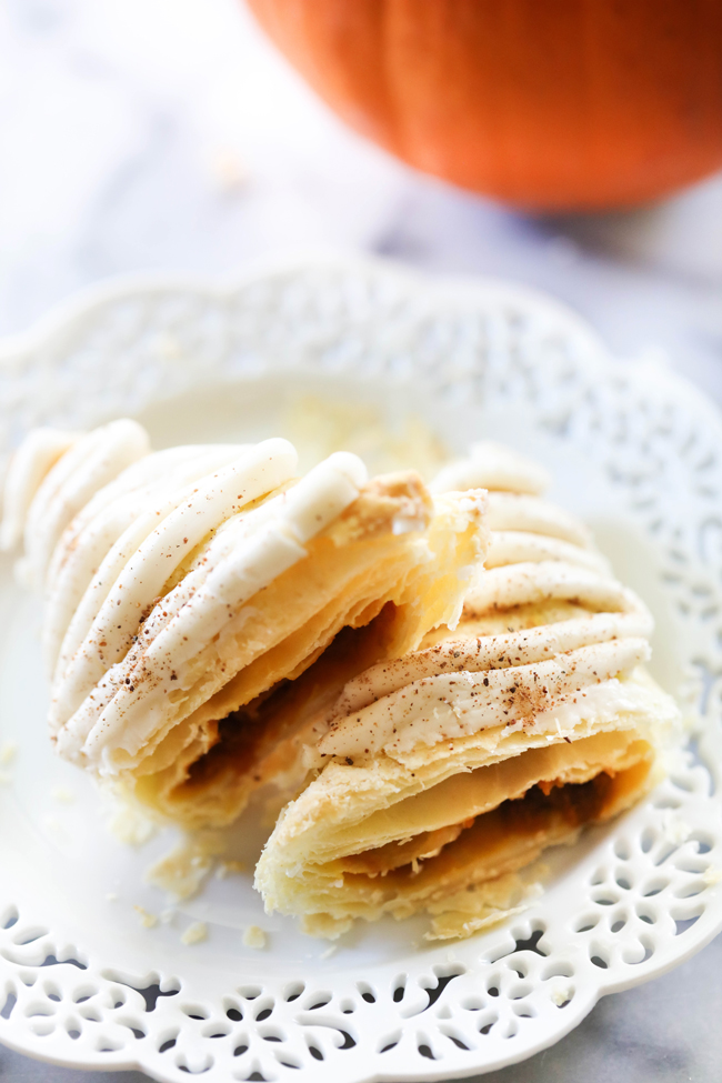 These Pumpkin Turnovers are a delicious fall treat. These are a delightful treat encompassing creamy pumpkin filling enveloped in a buttery and flaky puff pastry and drizzled with a wonderful frosting.