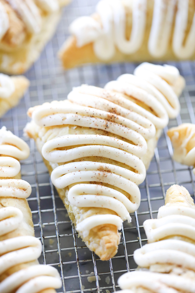 These Pumpkin Turnovers are a delicious fall treat. These are a delightful treat encompassing creamy pumpkin filling enveloped in a buttery and flaky puff pastry and drizzled with a wonderful frosting.