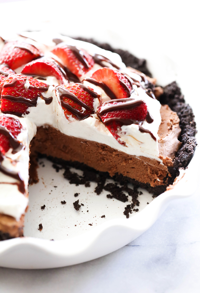 This Chocolate Strawberry Silk Pie is so silky smooth and has such a bold and rich flavor. If you are a chocolate connoisseur, this is the pie for you! It begins with an Oreo Cookie Pie Crust, filled with the delicious silky chocolatey filling and topped with delightful sweetened whip cream and gorgeous strawberries.