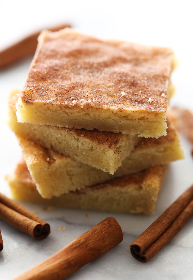 These Snickerdoodle Cookie Bars are outstanding. No more rolling each ball of dough individually- this recipe turns a time consuming recipe into an easy, quick method. Enjoy the delicious snickerdoodles in bar form. A delicious blend of cinnamon-sugar coat the top of the moist and soft cookie bars. This will be a recipe you want to make over and over again!