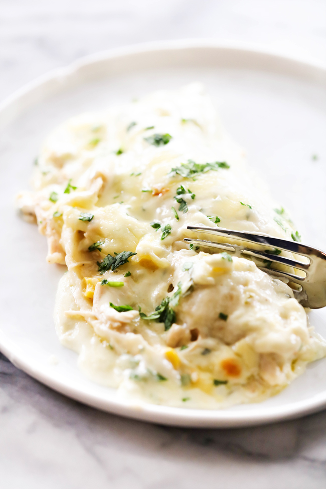 Chicken Blanco Enchiladas... These enchiladas will be THE BEST you ever have! The creamy blanco sauce is heavenly. The enchilada filling has just the right amount of spice and flavor. This dinner will become a menu regular and a new family favorite!