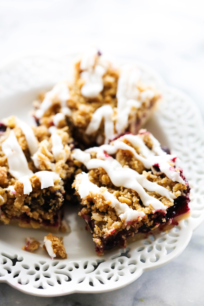 Blueberry Cookie Crumble Bars displayed on a white plate.
