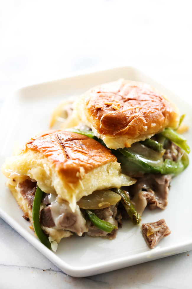 These Philly Cheese Steak Sliders are perfect for game days, parties, or dinner. They are loaded with roast beef, green peppers, provolone cheese, sautéed onions and mayonnaise. This is a meal that will please the masses and have everyone coming back for more!