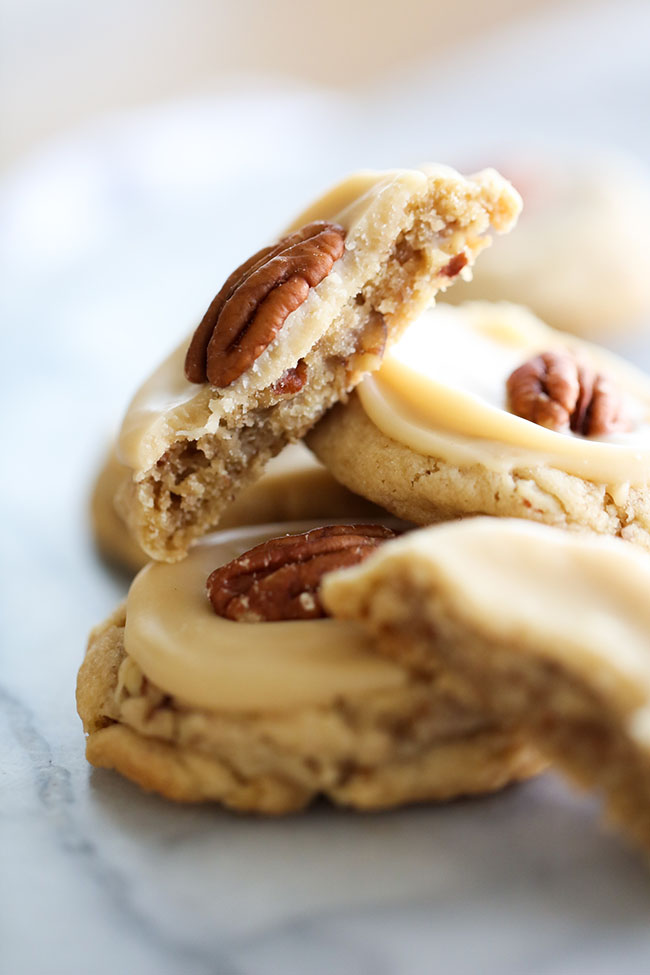 Pecan Cookies topped with Caramel Icing and a pecan.